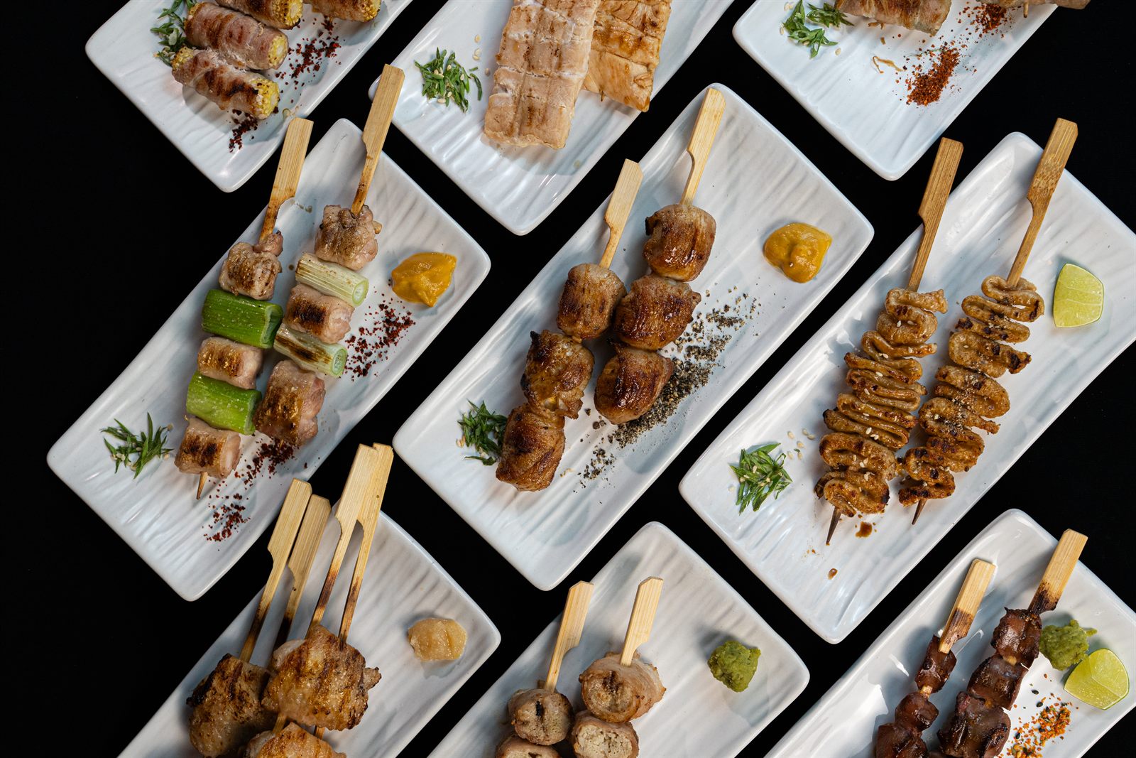BinchoTan-grilled yakitori skewers plated at Kura Samui